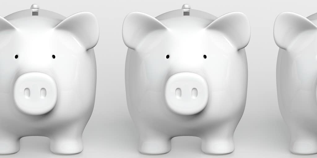 3 white piggy banks against white background