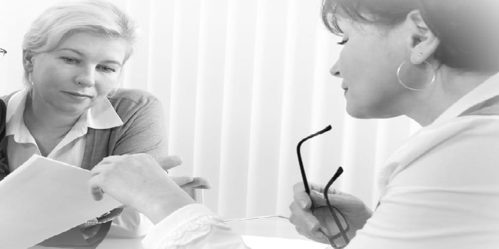 two women reviewing estate planning documents