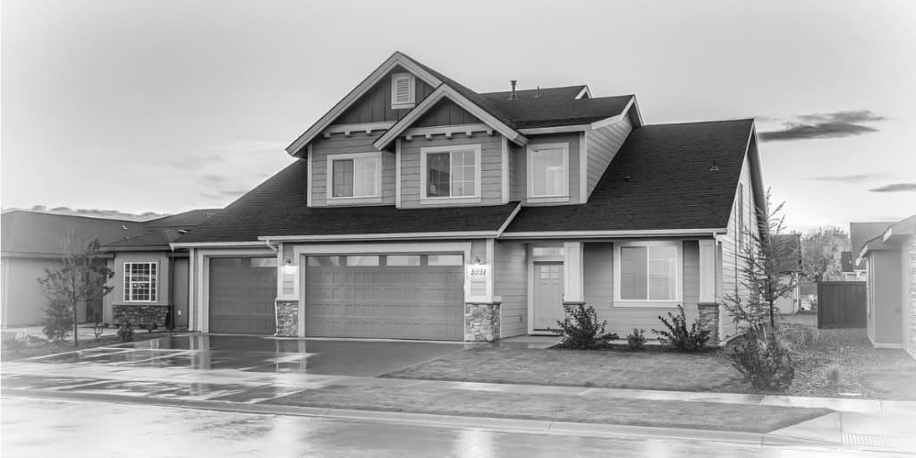 black and white exterior photo of a two story home