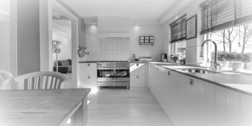 black and white image of a large kitchen