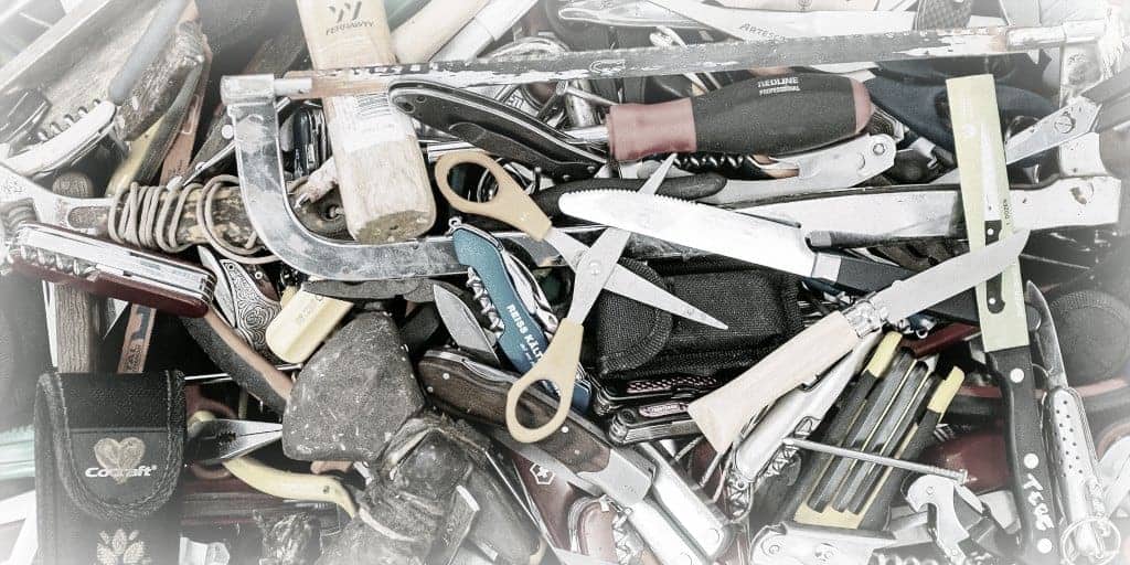 large pile of small tools needed for home diy projects including scissors screwdrivers and knives