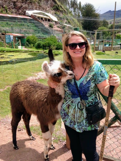 Bonnie Truax with a llama in Peru