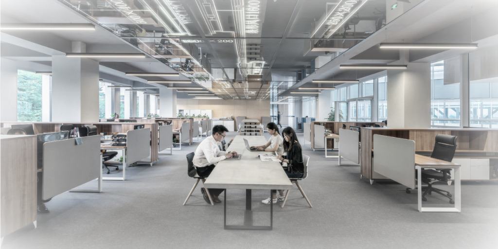 office work space, colleagues at a work table