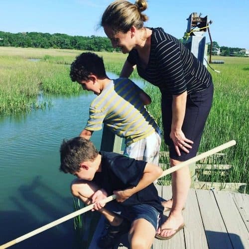 Laurie and her boys looking in a river bed