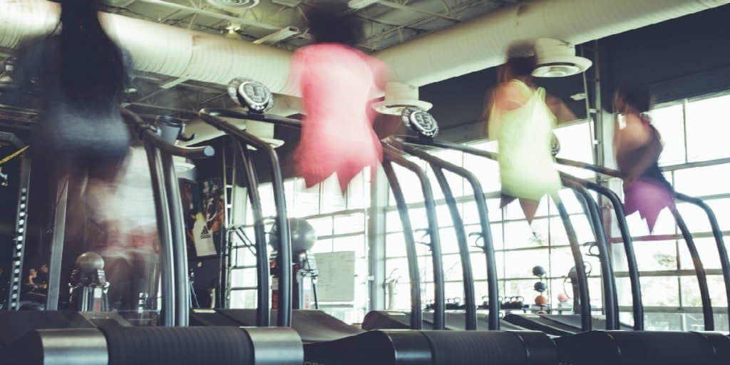 4 women running on treadmills at the ymca