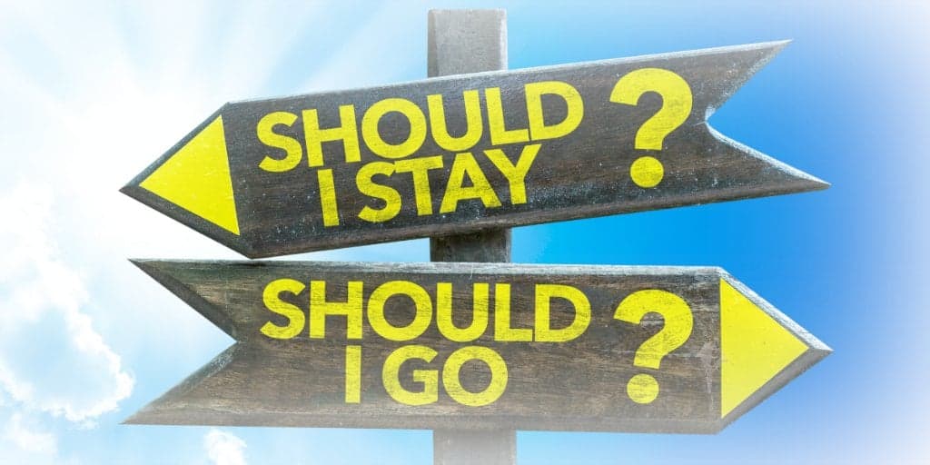 road signs - asking about moving to a lower cost of living area - should I stay or should I go