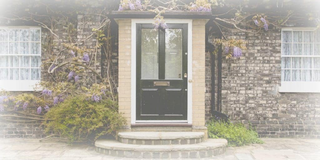 black front door on a brick home