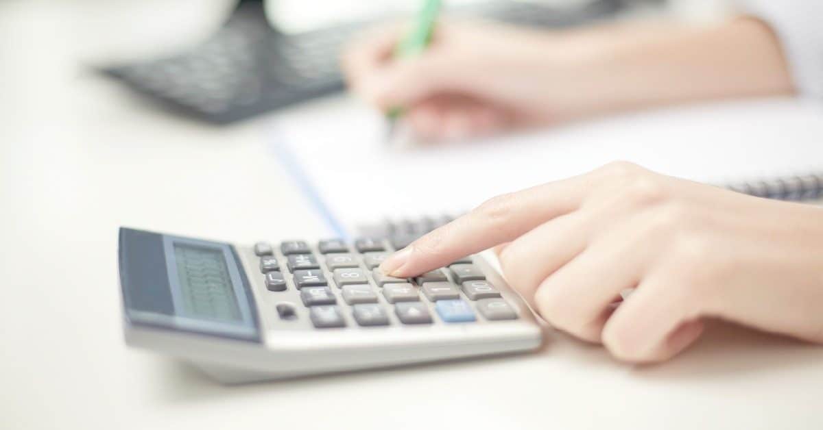 adding up expenses on calculator