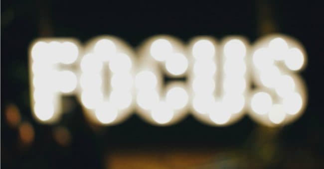 the word focus in bright lights out of focus