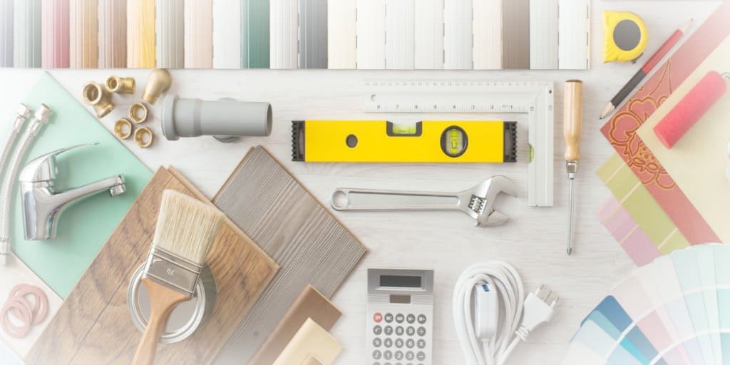 level, wrench, calculator, paint samples, and other items needed for home renovation projects