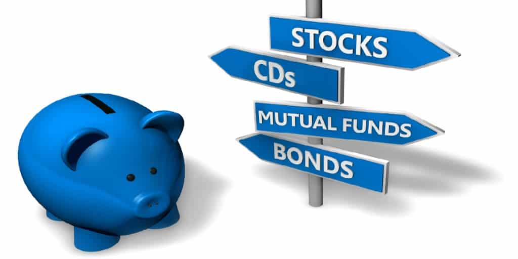 blue piggy bank and a graphic arrow sign with investing options pointing in different directions