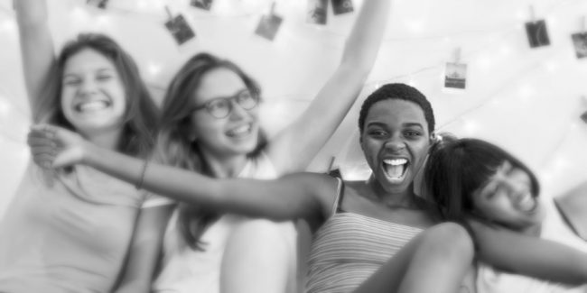 diverse group of four female roommates