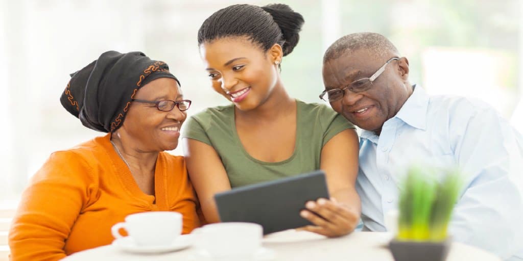 female showing her parents financial information on her tablet