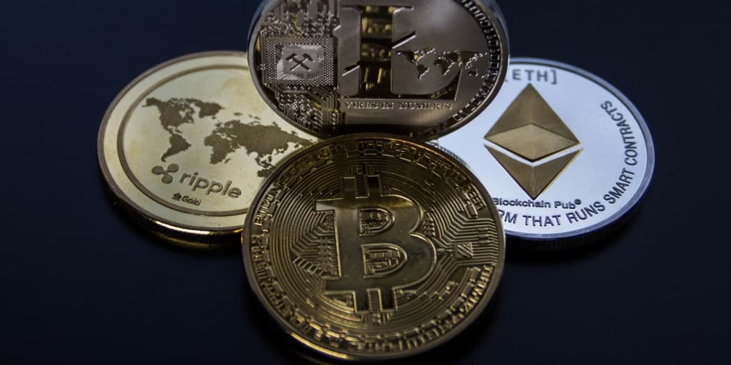 four different cryptocurrency coins