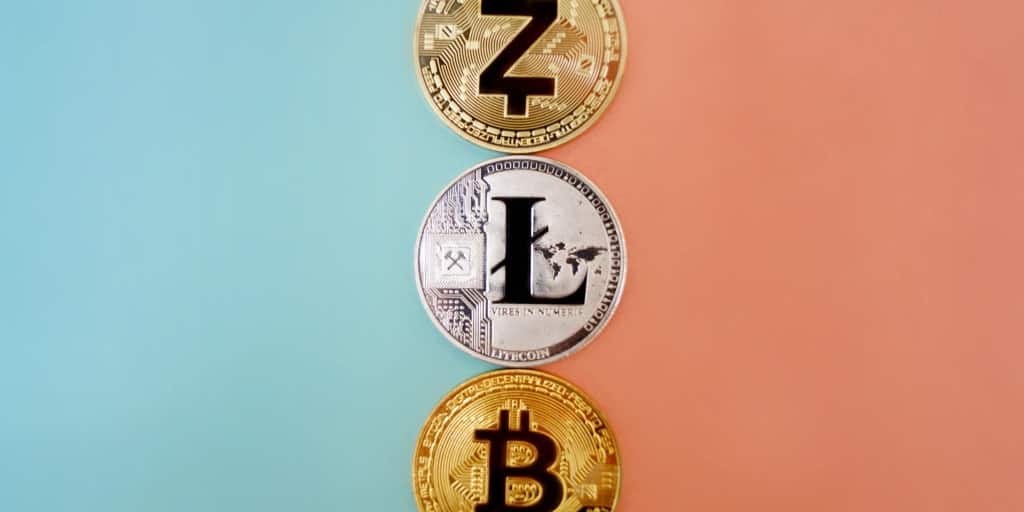 3 coins representing 3 different cryptocurrencies