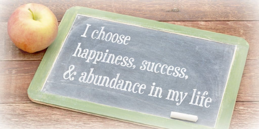 i choose happiness-success-and abundance in my life written on a chalkboard