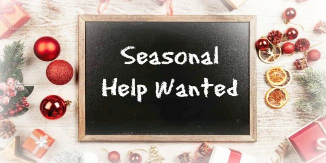 seasonal help wanted sign looking for workers who want a seasonal job to earn extra money