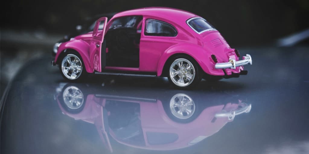 model of a pink volkswagen beetle car