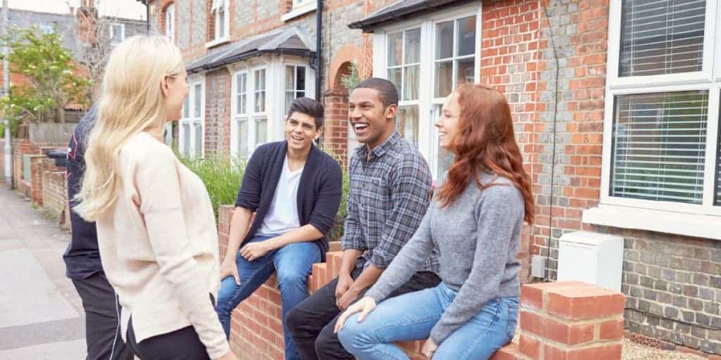 college students outside rental house