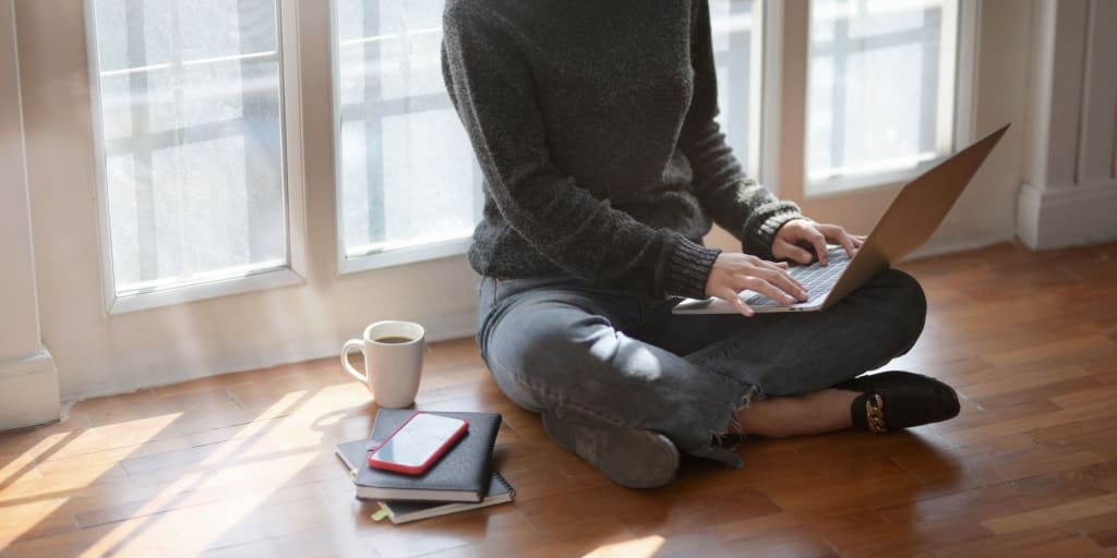 female working on laptop organizing drive files