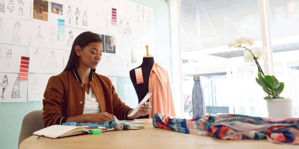 female entrepreneur reviewing a list of challenges she needs to address