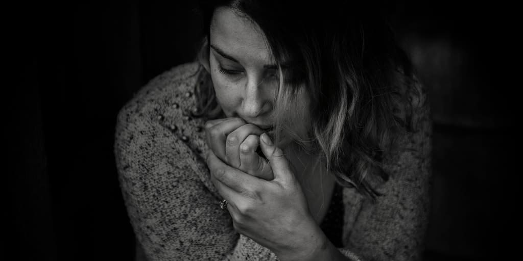 woman contemplating a money decision