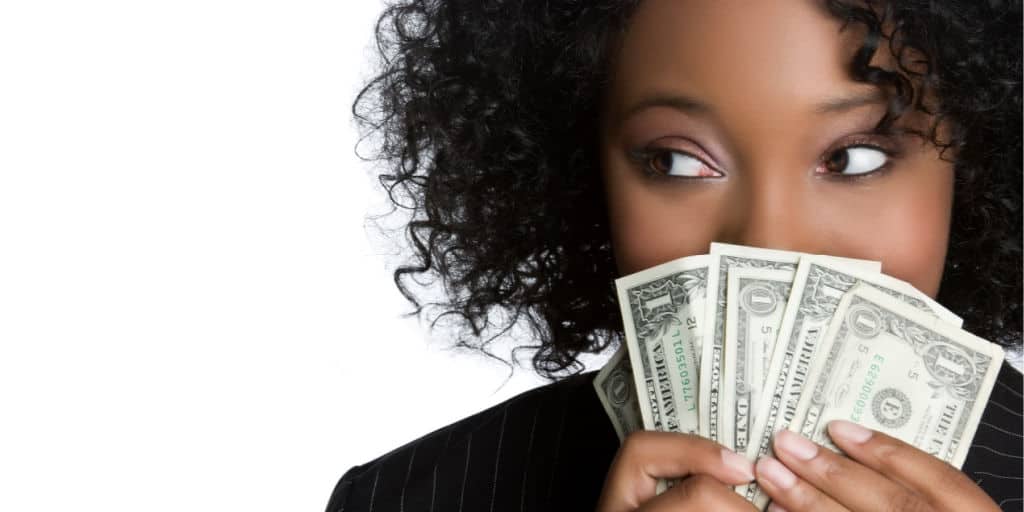 Young black women having fun with money