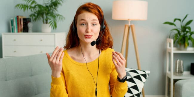 young red headed woman interviewing virtually for a job