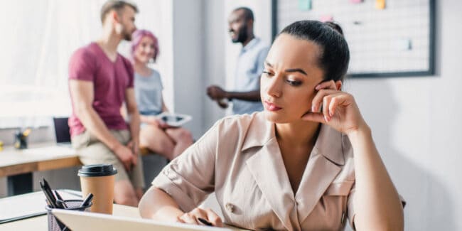 Selective focus of businesswoman using laptop in work office