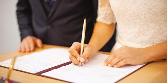 Photo of a wife and husband at civil registration, ceremony day