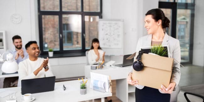 three employees welcoming new female employee