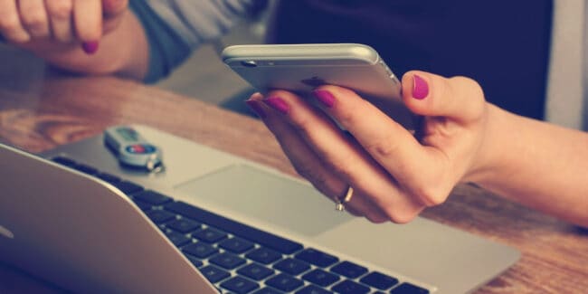 woman using financial app on phone