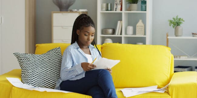 young african american woman reviewing estate planning documents