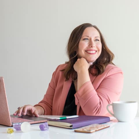 Victoria Sexton headshot at desk